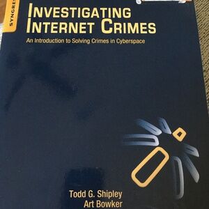 Paperback book. “Investigating Internet Crimes”